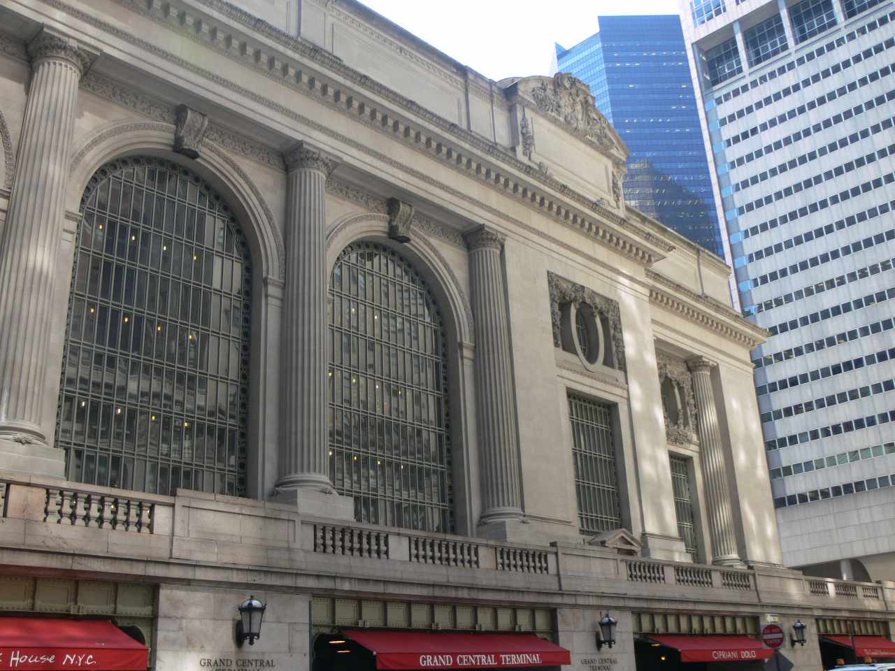 The west balcony of Grand Central Terminal features red awnings, with Michael Jordan