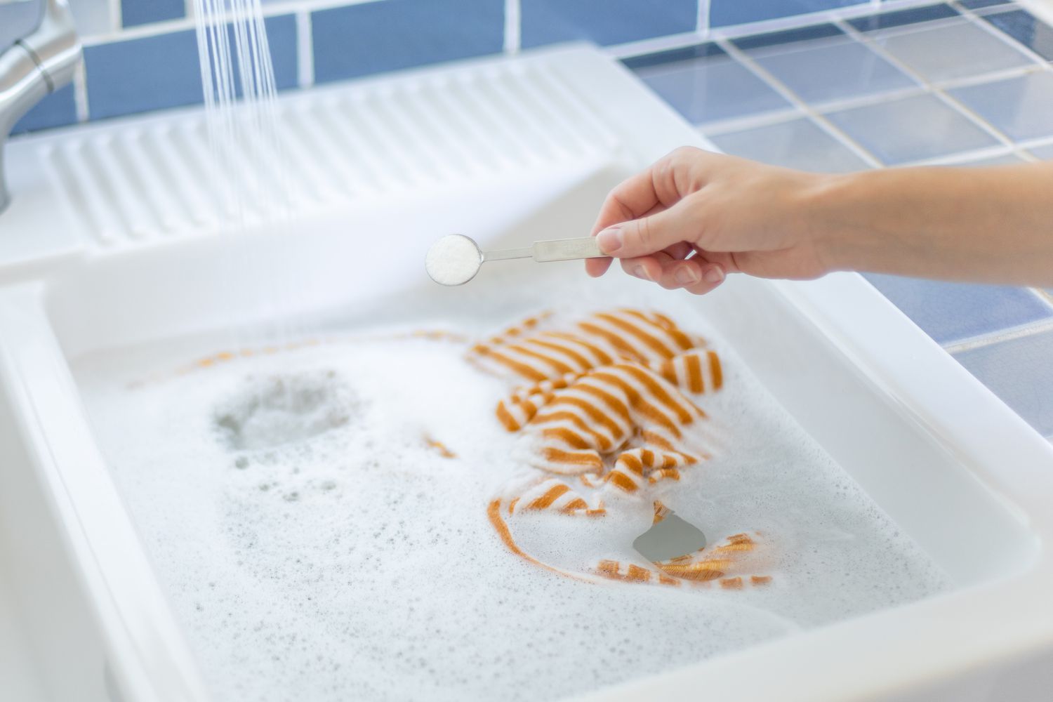 utilizing a teaspoon of detergent for initial soaking