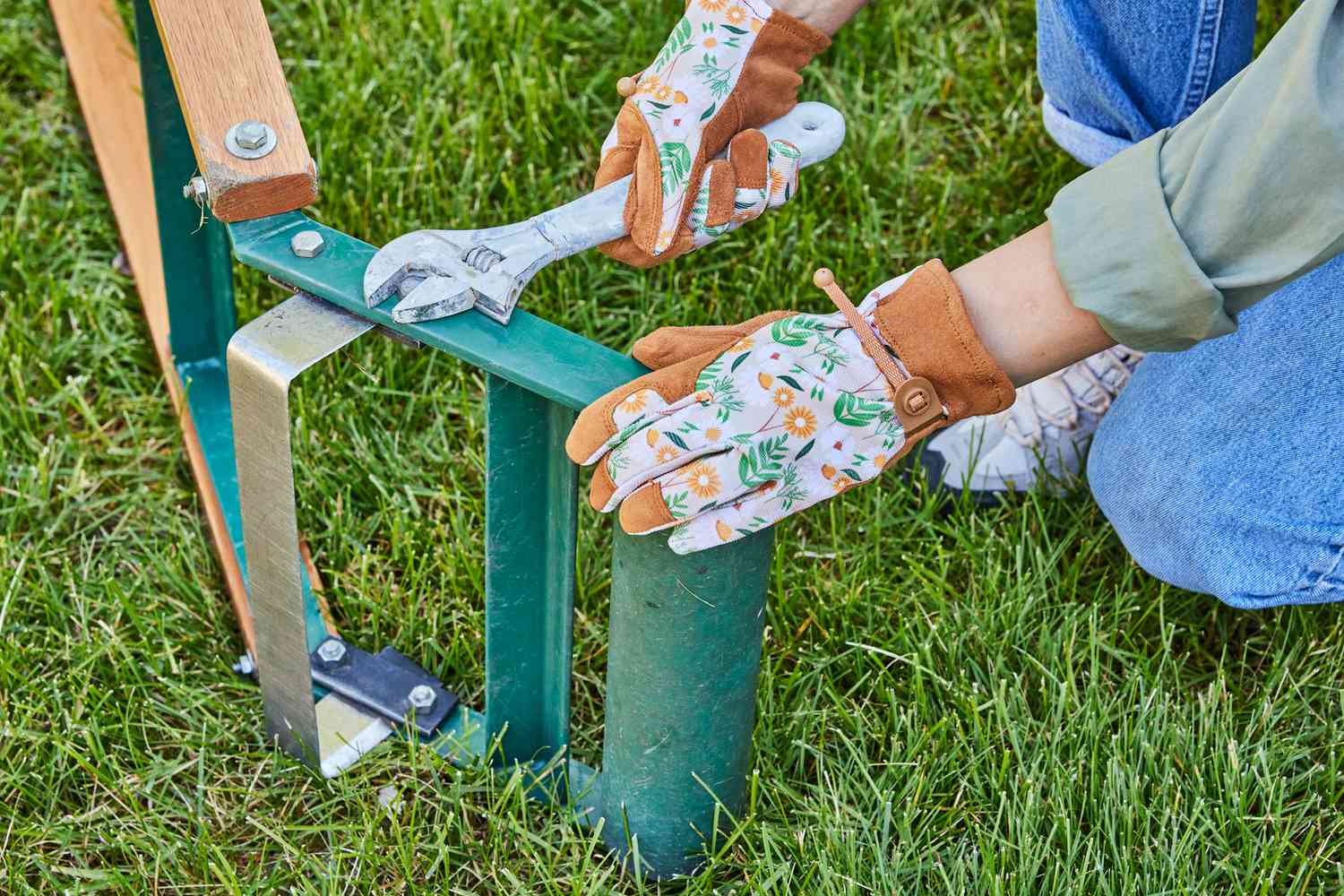 Adjusting the depth of the blade on a sod cutter.