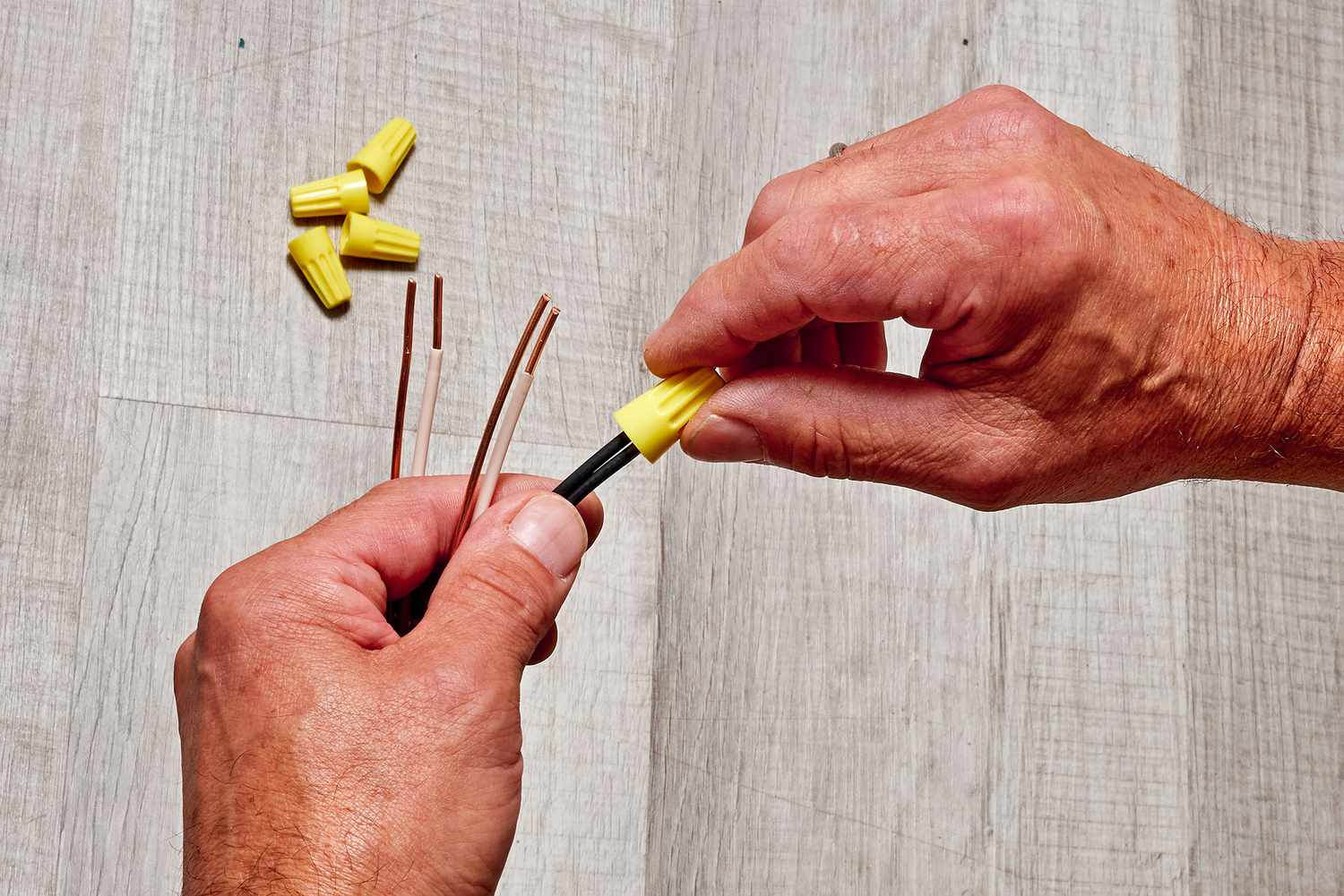 The ends of the wires were inserted into the yellow connectors and twisted together.